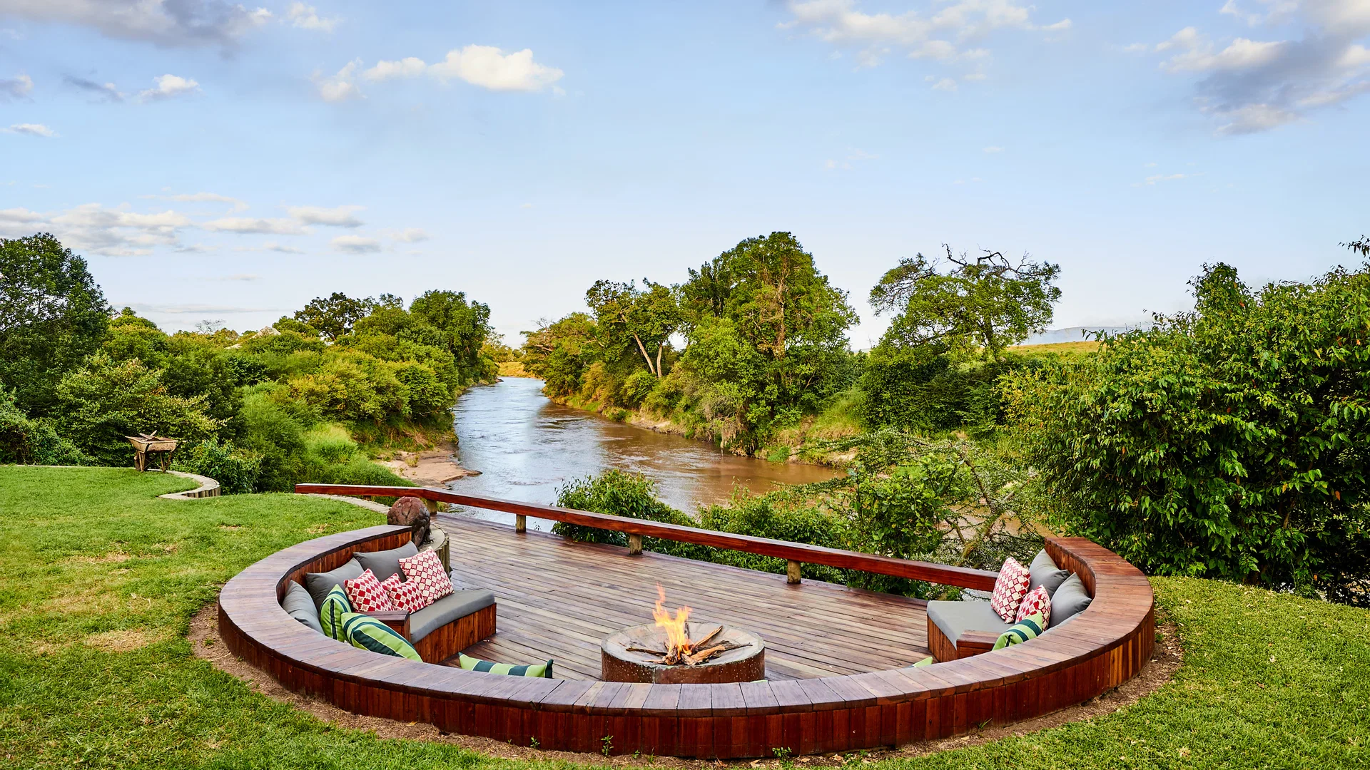 Firepit seating beside the river at Sala’s Camp in the Maasai Mara