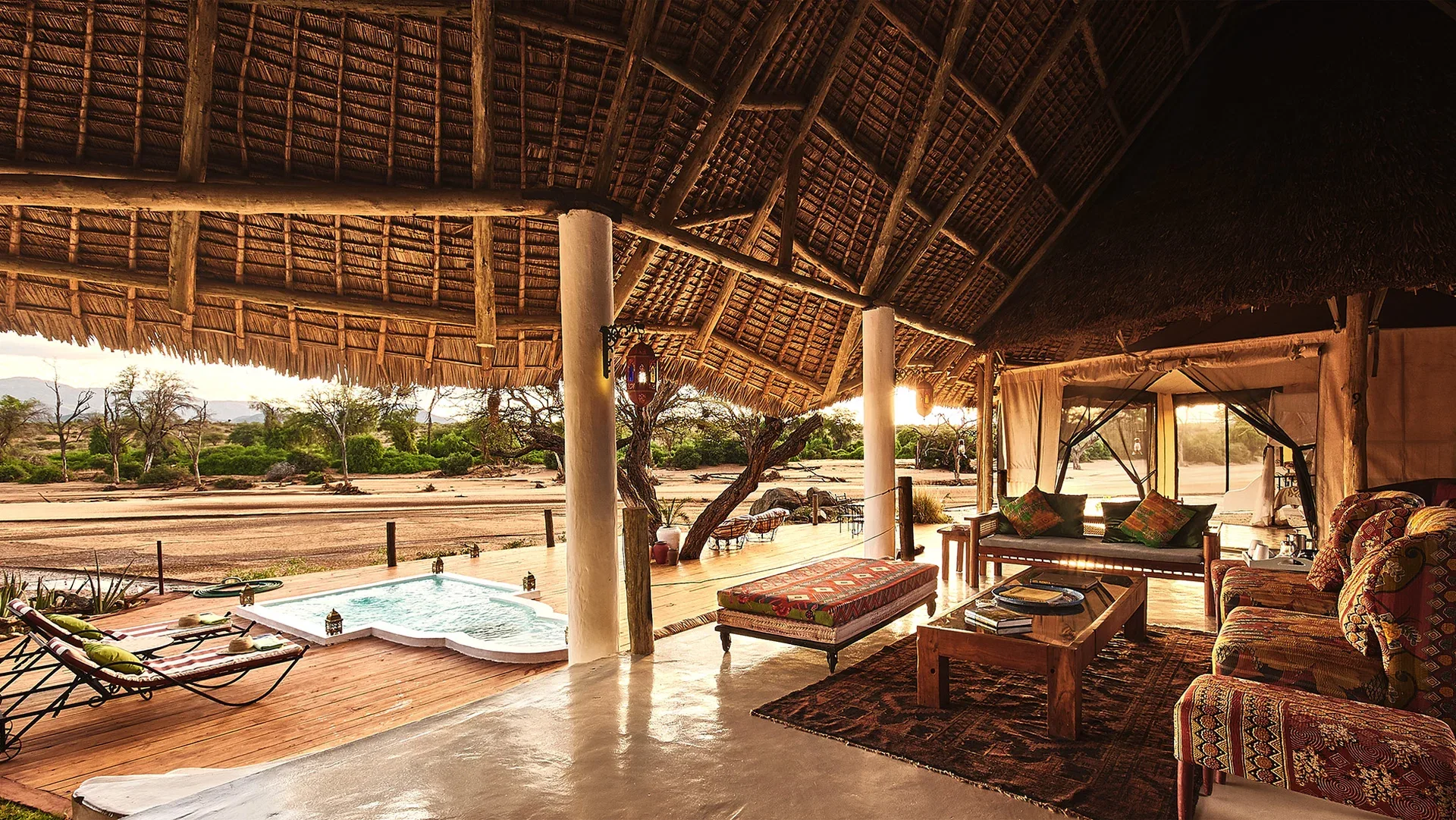 Open-air living area at Sasaab Lodge with a private plunge pool and views across the Samburu landscape.