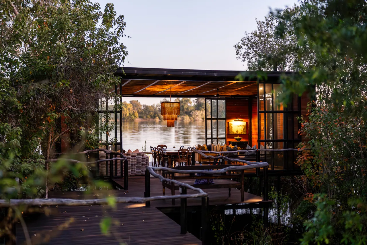 River Lounge at Mukwa River Lodge, with seating overlooking the river