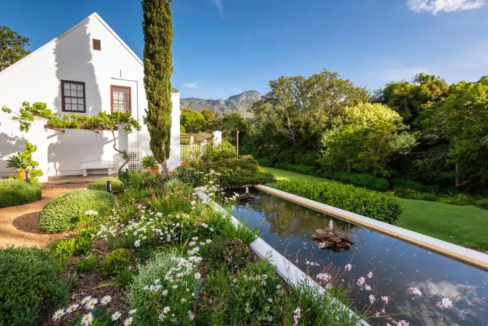 Landscaped gardens and Cape Dutch architecture at The Cellars-Hohenort in Constantia, Cape Town.
