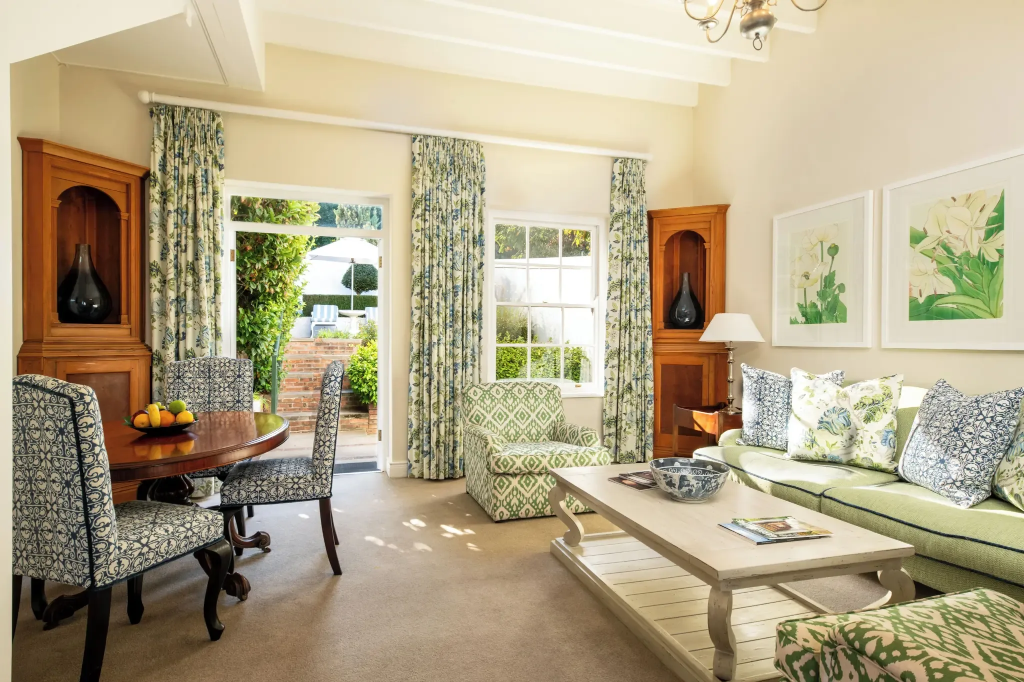 Living and dining area in a two-bedroom villa at The Cellars-Hohenort in Cape Town