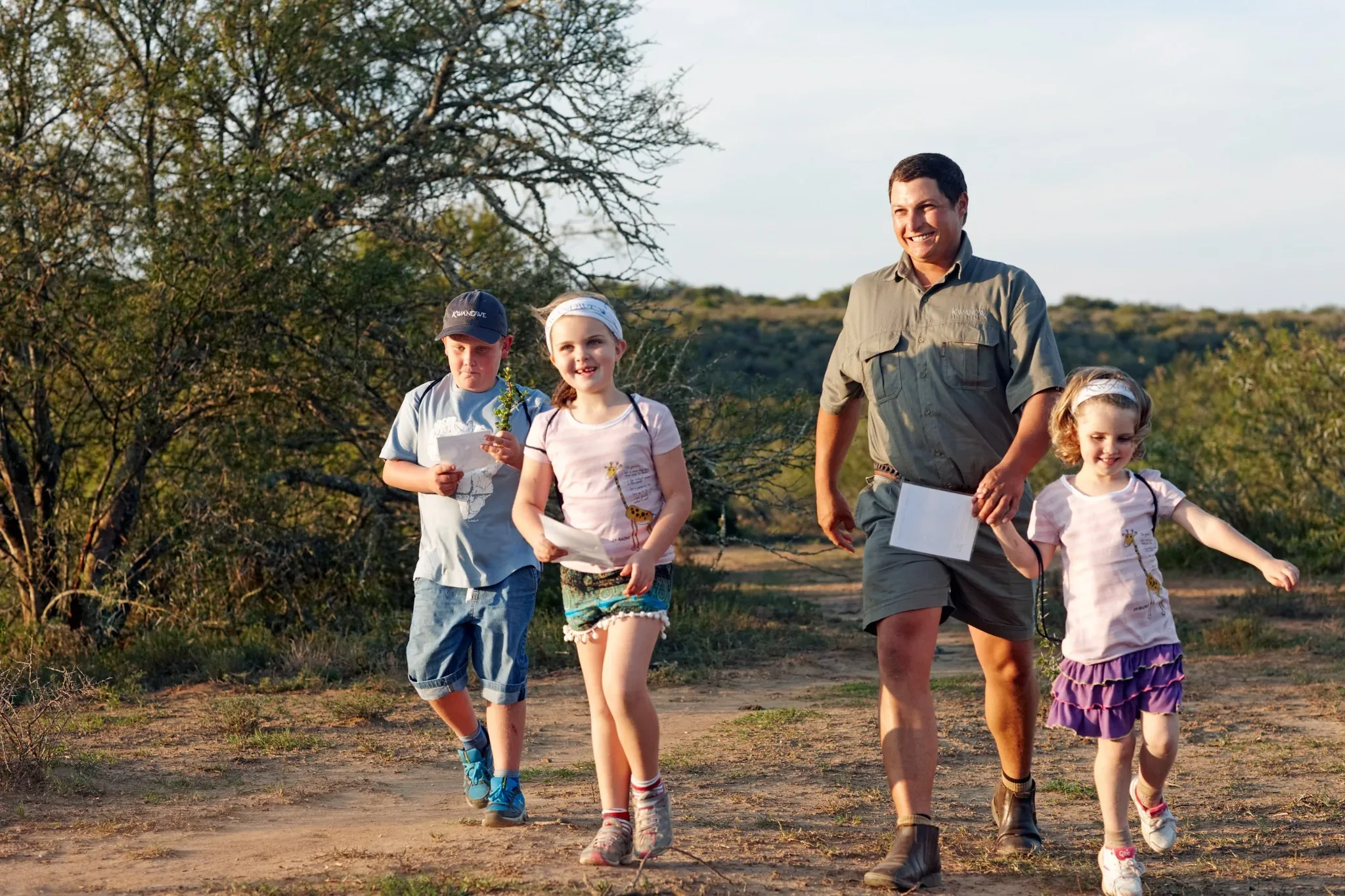 Children exploring the bush with a guide at Kwandwe Private Game Reserve