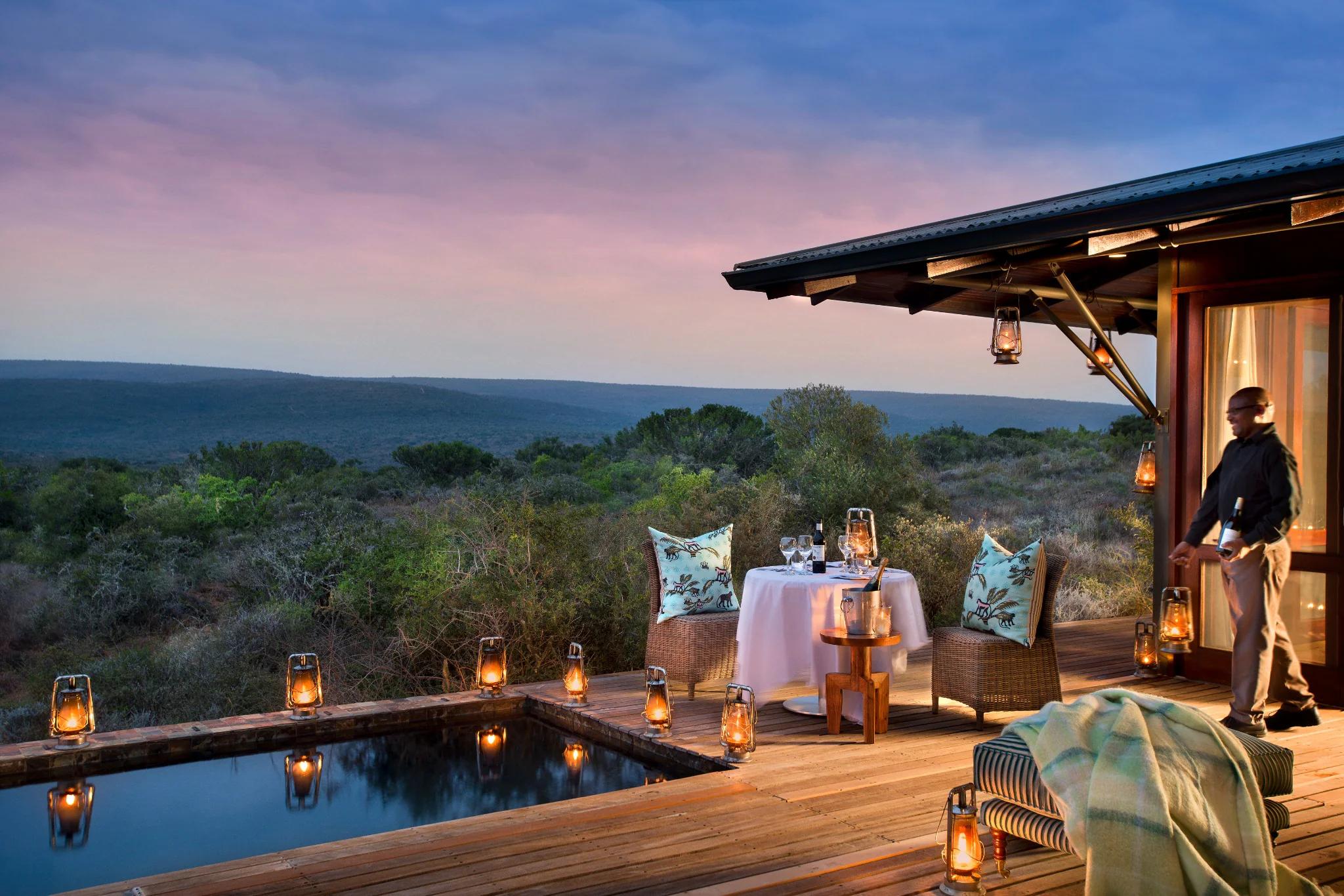 Lantern-lit private dinner setting overlooking Kwandwe Private Game Reserve
