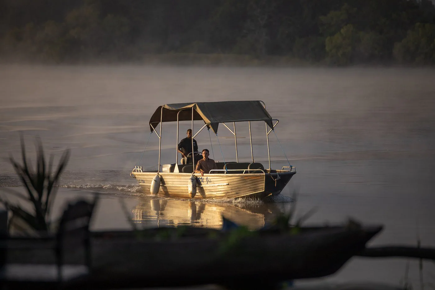 Boat cruising on the Zambezi River near Mukwa River Lodge in Livingstone, Zambia