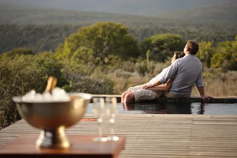 Guest beside a private pool overlooking Kwandwe
