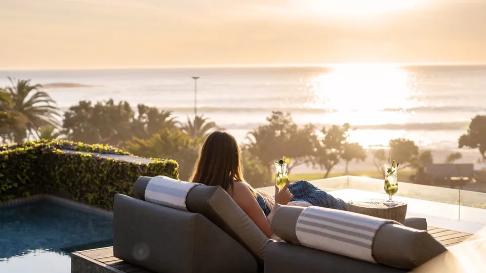 Guests looking towards the Atlantic from a terrace at POD Camps Bay